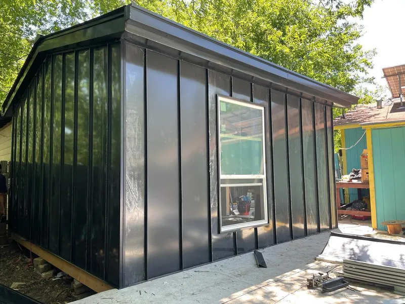 Black standing seam metal wall panels for Roof Inspection in Yulee